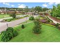 Gated community entrance with meticulously maintained landscaping and a serene fountain feature at 6527 Eagle Ridge Way, Lakeland, FL 33813