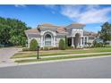 Charming single-story home with a tile roof and manicured landscaping at 6527 Eagle Ridge Way, Lakeland, FL 33813