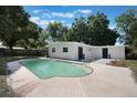 Beautiful pool and backyard with an exterior entrance to the home at 3813 Surrey Dr, Orlando, FL 32812