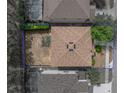 Aerial view of the home showcasing the roof, yard, and surrounding neighborhood at 143 Alfani St, Davenport, FL 33896