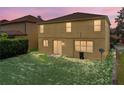 Spacious backyard with lush green grass and a privacy hedge, perfect for outdoor entertaining at 143 Alfani St, Davenport, FL 33896