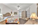 Bright bedroom with a ceiling fan and a comfortable bed at 3107 Stonewater Dr, Lakeland, FL 33803