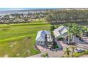 Scenic aerial view of home close to a golf course, a lake, and community amenities at 3270 Green Heron Dr, Polk City, FL 33868