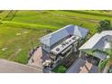 Aerial view of a charming home with RV parking and proximity to the golf course at 3270 Green Heron Dr, Polk City, FL 33868