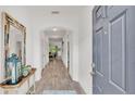 Welcoming entryway boasting an arched ceiling, wood flooring, and neutral paint colors at 3934 Aquilla Dr, Lakeland, FL 33810