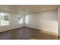 Bright bedroom with hardwood floors and large windows providing natural light at 445 Silverbell Trl, St Cloud, FL 34771