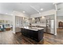 Well-lit kitchen showcases a center island, stainless steel appliances, and ample storage at 4642 Highlands Place Dr, Lakeland, FL 33813