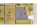 Aerial view of home showing roof and yard with a fenced-in backyard at 5458 Oakford Dr, Lakeland, FL 33812