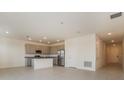 Bright open kitchen featuring stainless steel appliances and a granite countertop island at 606 Fairview Ave # 244, Haines City, FL 33844