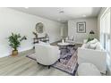 Comfortable living room boasts stylish furnishings, neutral color palette, and new flooring at 6338 Oak E Sq, Lakeland, FL 33813
