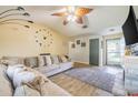 Inviting living room with wood-look floors, vaulted ceilings, and a comfortable sofa at 1434 Country Ridge Dr, Lakeland, FL 33801