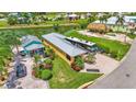 Aerial view of the property showcasing its layout, including the house, RV parking, and surrounding landscaping at 3261 Fish Hawk Dr, Polk City, FL 33868