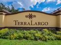 Terra Largo community sign surrounded by colorful flowers and greenery at 4125 Prima Lago Cir, Lakeland, FL 33810