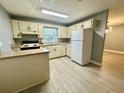 Traditional kitchen design with modern flooring at 4535 Weston Ct, Bartow, FL 33830