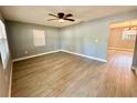 Spacious living room with modern flooring and a ceiling fan at 4535 Weston Ct, Bartow, FL 33830