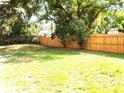 A spacious backyard featuring a newly installed wooden fence, offering privacy and a secure outdoor space at 4629 Harden Blvd, Lakeland, FL 33813