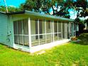 Enclosed screened porch, perfect for enjoying the outdoors in comfort and style at 4629 Harden Blvd, Lakeland, FL 33813