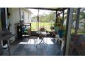 Inviting screened-in porch with comfortable seating, perfect for outdoor relaxation at 550 Patton Loop, Bartow, FL 33830
