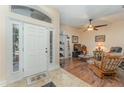 Spacious foyer with tile transitioning to wood floors and clear view into the living room at 6789 Ashbury Dr, Lakeland, FL 33809
