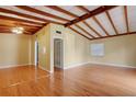 Bright living room with hardwood floors and exposed beam ceiling at 941 Avon Ave, Lakeland, FL 33801