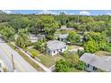 Spacious property with mature trees and a detached garage, providing ample outdoor space at 1020 E Palmetto St, Lakeland, FL 33801