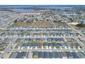 Aerial view of a neighborhood featuring well-maintained homes, landscaping, and community layout at 1034 Corso Dr, Winter Haven, FL 33884