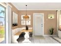Cozy dining area with built-in bench seating and a stylish pendant light at 124 Carolyn Dr, Lakeland, FL 33803
