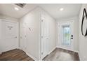 Bright entryway with decorative glass door and wood-look flooring at 133 Cloverbrook Trl, Davenport, FL 33837