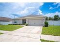 Inviting single-story home with driveway and attached two-car garage at 133 Cloverbrook Trl, Davenport, FL 33837
