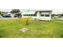 Charming single-story home with a lush green lawn and mature landscaping at 1610 Reynolds Rd # 204, Lakeland, FL 33801