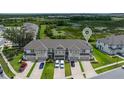 Scenic aerial view of well-planned townhouses, each with private driveways and beautiful landscaping at 1754 Sanibel Dr, Davenport, FL 33896