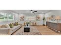 Inviting living room with stylish decor, comfortable seating, and a large window for natural light at 1920 Kimball S Ct, Lakeland, FL 33813