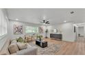 Bright living room with hardwood floors, contemporary furnishings, and plenty of natural light at 1920 Kimball S Ct, Lakeland, FL 33813