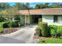Charming single-story home featuring an open carport, well-maintained landscaping, and a welcoming front entrance at 2203 Starboard, Winter Haven, FL 33881