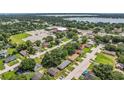 Neighborhood aerial shot showcasing the home's location with a park, lake, and community center nearby at 3016 Reiter Dr, Auburndale, FL 33823