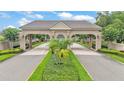 Elegant community entrance with manicured landscaping and a welcoming ambiance at 3121 Highlands By The Lake Way, Lakeland, FL 33812