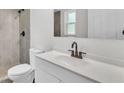 Modern bathroom with tiled shower, updated fixtures, sleek vanity, and ample natural light at 6 Rosewood Dr, Davenport, FL 33837
