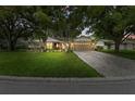 Beautiful home with manicured lawn and large trees at 6342 Butternut Dr, Lakeland, FL 33813