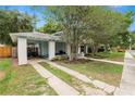 Charming bungalow with a carport and mature landscaping at 817 College Ave, Lakeland, FL 33801