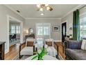 Inviting living room with hardwood floors, neutral tones, and natural light at 838 S Tennessee Ave, Lakeland, FL 33801