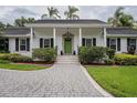 Inviting front entrance with a well-manicured lawn and attractive landscaping at 1425 Hallam Dr, Lakeland, FL 33813