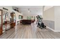 Open living space with new flooring, vaulted ceilings, and ample natural light at 1531 Blue Sky Blvd, Haines City, FL 33844
