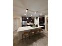 Spacious kitchen featuring an expansive center island with bar seating, perfect for entertaining and casual dining at 4124 Prima Lago Cir, Lakeland, FL 33810
