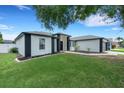 Beautiful one-story home boasts lush green lawns, fresh landscaping, and a well maintained two car garage at 7642 Habersham Dr, Lakeland, FL 33810