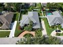 An aerial view showcases the home's roof, landscaping, and spacious yard at 943 Hamilton Place Ln, Lakeland, FL 33813