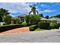 Charming single-story home with lush landscaping, mature trees, and a circular driveway at 943 Hamilton Place Ln, Lakeland, FL 33813