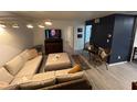 An inviting living room with a comfortable wicker sectional sofa and stylish decor at 1100 Martinique Dr # 203, Winter Haven, FL 33884