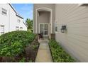 This cozy front porch features brick accents, lush landscaping, and inviting pathway to the entrance at 1117 Stonebrooke Ln # 58, Lakeland, FL 33803