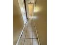 Hallway with tile floor leading to other rooms at 1120 Ivy Ln, Bartow, FL 33830