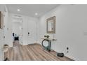 Bright foyer with modern accents, and wood floors at 1125 Mattie Pointe Blvd, Auburndale, FL 33823